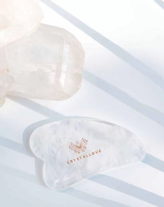 Crystallove gua sha kasvohierontalevy, jolla on puhdistusominaisuuksia. - 2