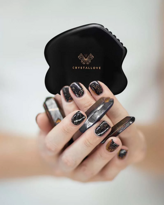 Gua sha kasvohierontalevy, joka on valmistettu obsidiaanikivestä, jolla on suuri voima Crystallove - 2